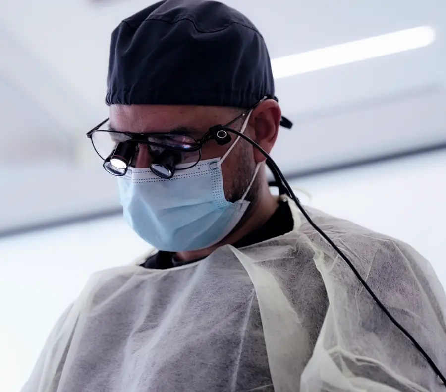 The dentist at Metropolitan Smile Design wearing magnifying loupes