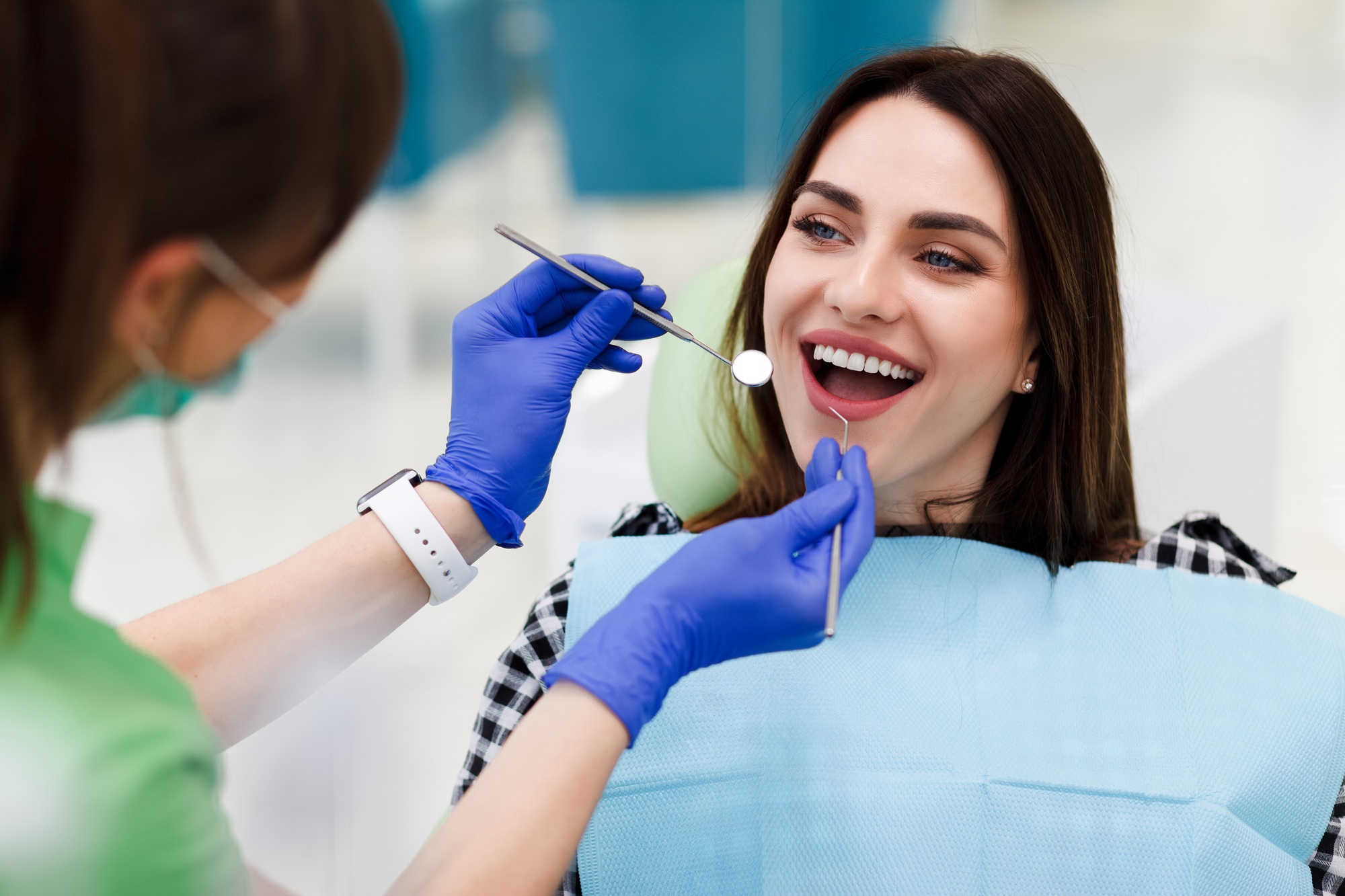 Cosmetic Dentist in Broward County 5 Smiling woman at the dentist's appointment.