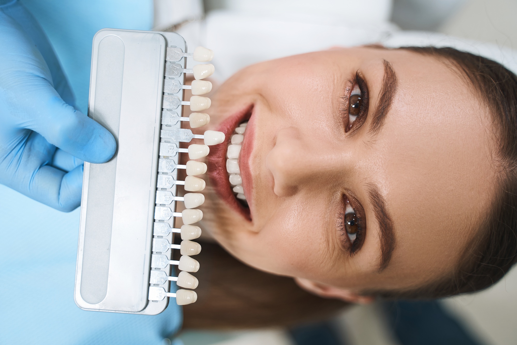 Cosmetic Dentist in Broward County 6 Smiling woman is choosing veneers stock photo