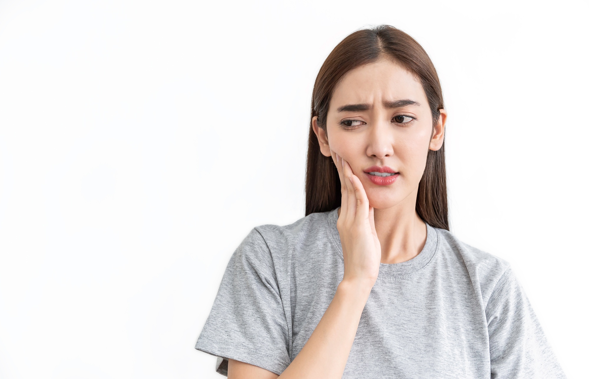 Portrait of asian female feeling painful toothache. Teeth problem woman feeling tooth pain