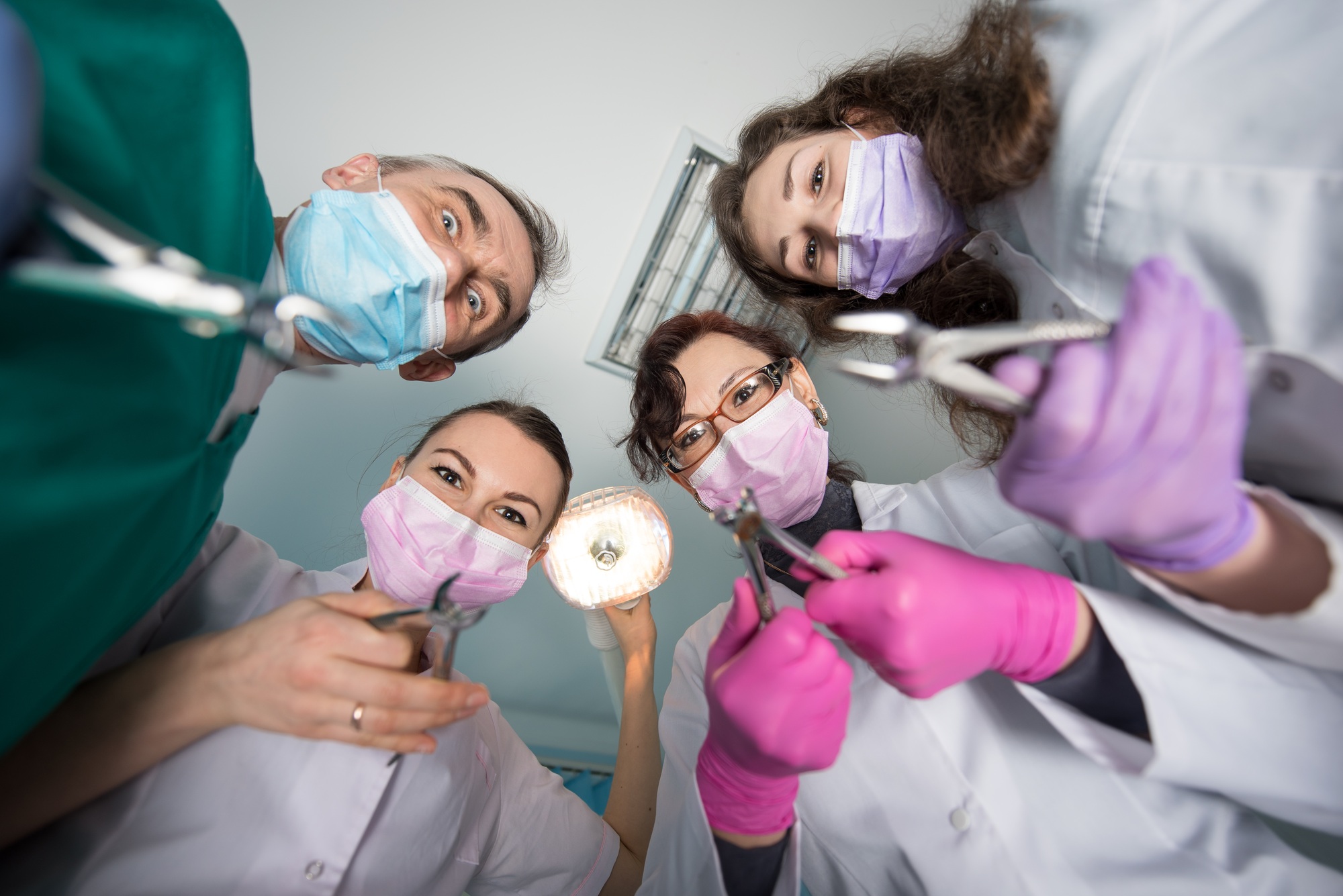 Professional dental team with removers at dental office. Dentistry