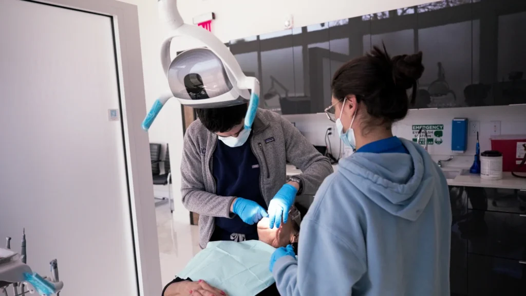 Home 5 Dental team treating a patient at Metropolitan Smile Design
