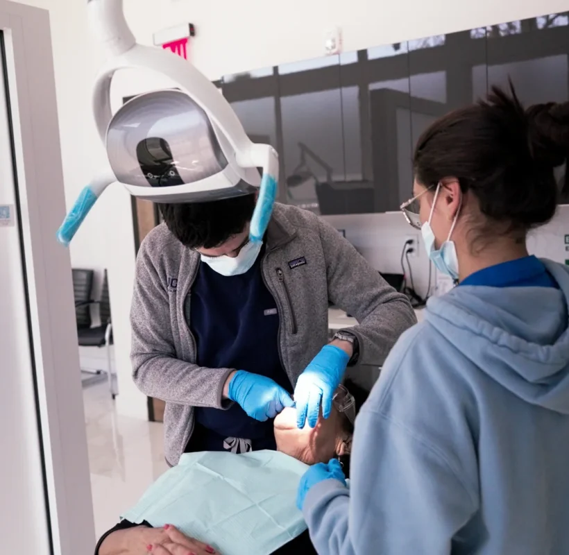 Dental team treating a patient at Metropolitan Smile Design, Tamarac FL